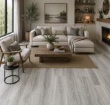 2032 Eternity Grey 5MM Desertland SPC flooring installed in a modern living room featuring cool grey oak tones and elegant contemporary styling