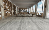 Modern interior showcasing SA252 Eternity Mist 5MM SPC flooring with dark gray wood-look finish and realistic grain detail