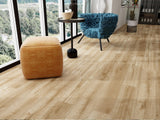 Modern interior showcasing SA357 Morning Mist Glue Down LVT flooring with warm brown wood tones and realistic grain detail