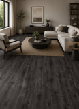 Modern living room showcasing SA68 Charcoal Sand 5MM Desertland SPC flooring with dark oak wood appearance and textured grain detail